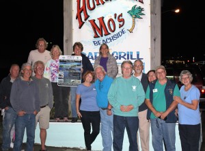 The members of the OBX Parrot Head Club present the donation to Chris Pruitt, N.E.S.T. Treasurer, with George and Dennis N.E.S.T. members standing by with smiles.