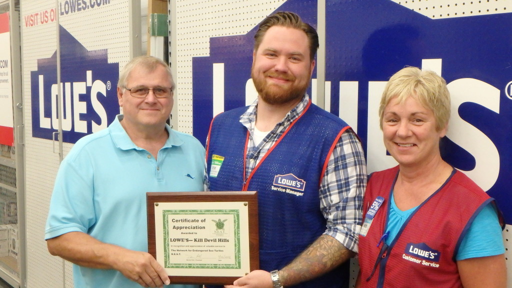 Dennis Pohl, N.E.S.T. on behalf of N.E.S.T. members thank Steve Sanders, Lowe's of Kill Devil Hills Assistant store manager and Patty Sansotta, Human Resource Manager for their support.