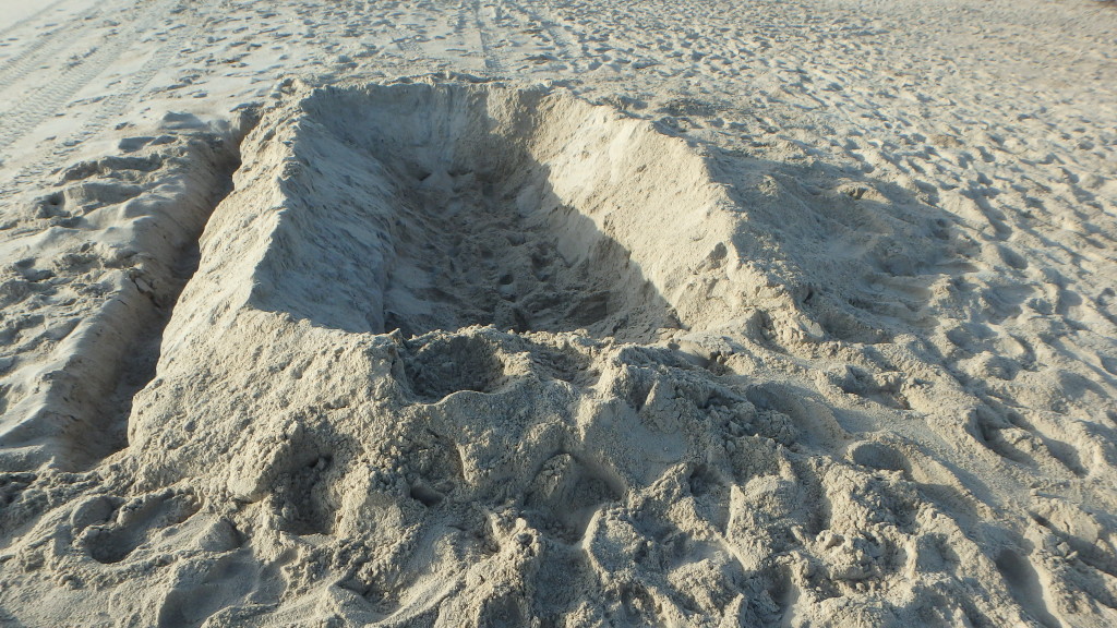 A dangerous sand pit left on the beach overnight.